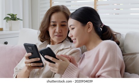 Attractive Beautiful Asian Family Sit Sofa Couch Living Room Enjoy Urban Life Joyful Promotion Discount Shop Buy Health Care Insurance Online Quarantine Activity Isolate Omnichannel Experience At Home