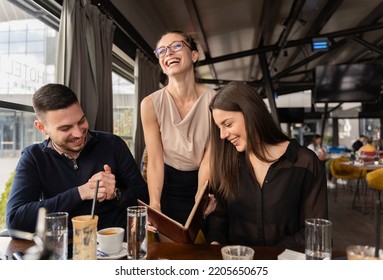 Attractive and beautiful boss lady is showing them something and laughing - Shutterstock ID 2205650675