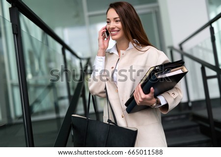 Attractive and beautiful businesswoman talking on cellphone