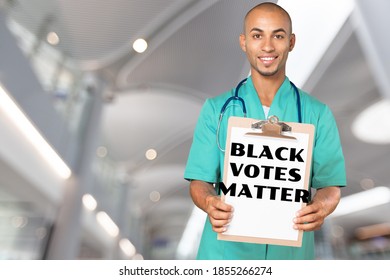 Attractive Black Activist Holding A Voter Suppression Sign