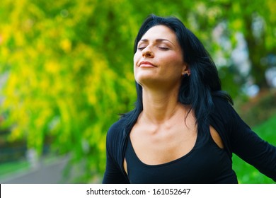 Attractive Black Hair Woman Breathing And Relaxing In Nature