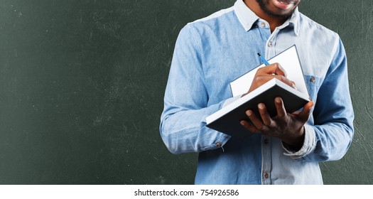 Attractive Black Man Writing Notes