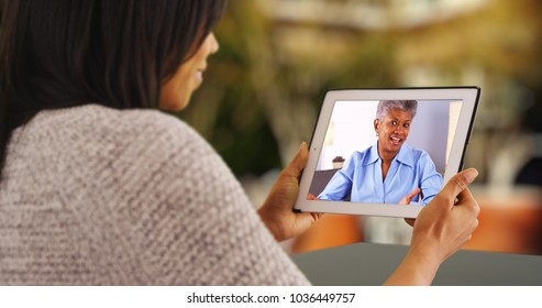 Attractive Black Woman Video Chatting With Mother From Home