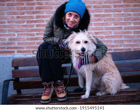 Similar – Portrait of a young, tall woman behind a blond Labrador