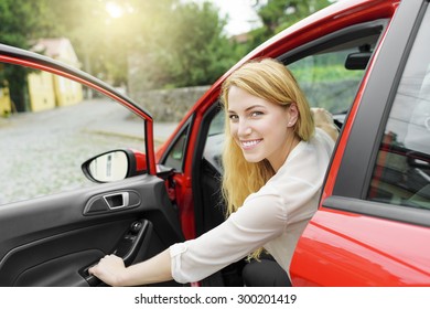 Attractive Blonde Woman In The Car, Opens The Car Door.