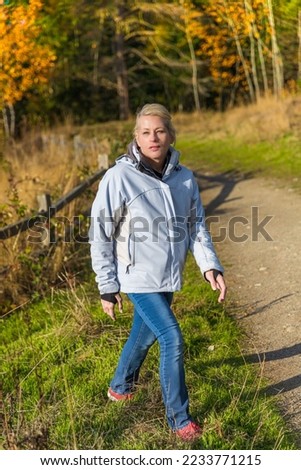 Similar – Porträt einer jungen Frau geht als Training nach draußen.