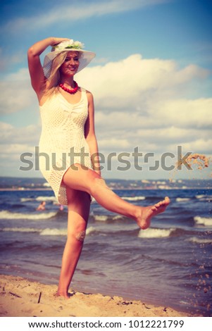 Similar – Young, slim woman on the beach of the Baltic Sea in summer wind