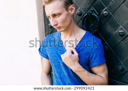 Attractive blue eyed, blond young man on the street