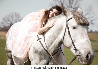 Attractive bride is sitting on the horse