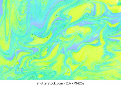 Attractive bright marble gradient  abstract background mixed yellow  green   blue nail polish  colorful surface