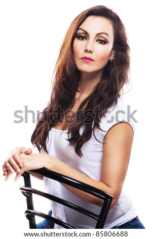Attractive bright serious woman long wavy hair sitting chair