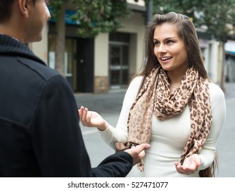 Attractive Brunette Girl Flirting With Guy At The Street
