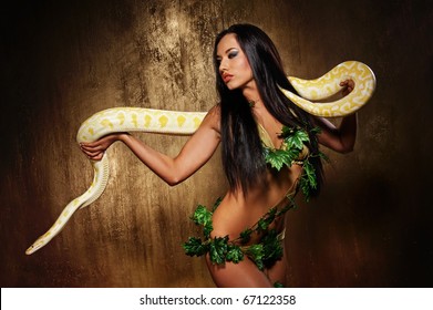 Attractive brunette woman with python