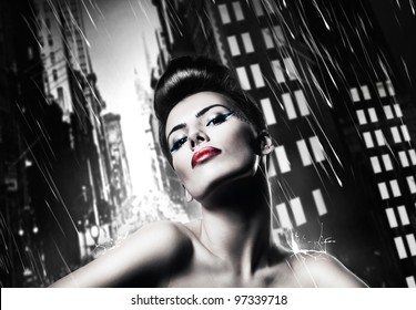 Attractive Brunette Woman With Red Lips In Rainy City