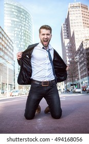 Attractive Business Man Is Celebrating On His Knees