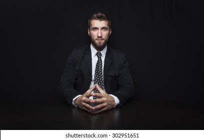 Attractive Business Man In Front Of A Black Background