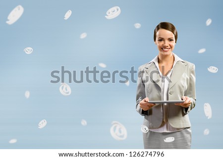 attractive business woman holding a tablet, fly around the signs e-mail