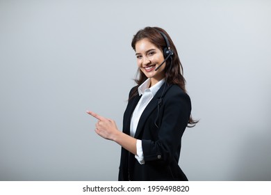 Attractive Business Woman In Suits And Headsets Are Smiling While Working Isolate On White Background. Customer Service Assistant Working In Office. VOIP Helpdesk Headset