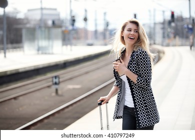 Attractive Business Woman At A Train Station