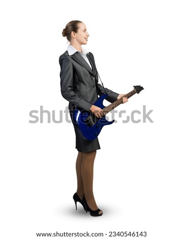 Attractive businesswoman with electric guitar. Creativity and speed in business
