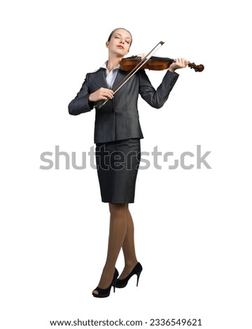 Attractive businesswoman plays the violin. On a white background. Full length photo