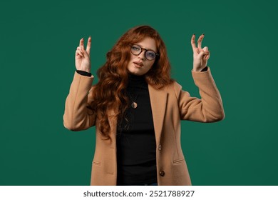 Attractive BusinessWoman or student lady with hands two fingers air quotes gesture on green, sarcasm. High quality - Powered by Shutterstock