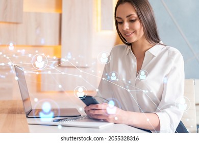 Attractive businesswoman in white shirt using smart phone to check new candidates for international business consulting. HR, social media icons over modern office background. - Powered by Shutterstock