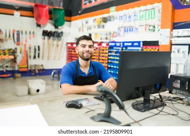 Attractive cashier and store worker sitting at the computer desk and ready to help a client or give customer service 