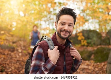 Attractive Caucasian Couple Hiking Through The Forest In The Fall In Canada