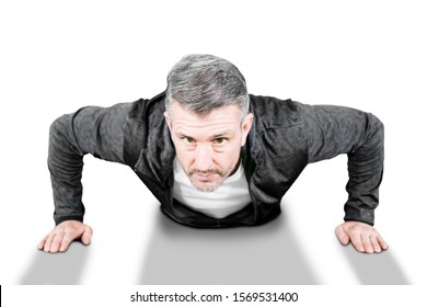 Attractive Caucasian Man Aged 40s Doing Push-ups Exercise Isolated Over White