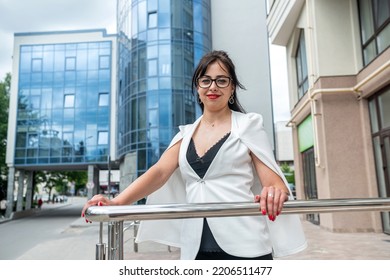 Attractive CEO Senior Business Woman Executor Of Important Errands .portrait Posing Standing Outside Workplace In City Center. Woman In Business