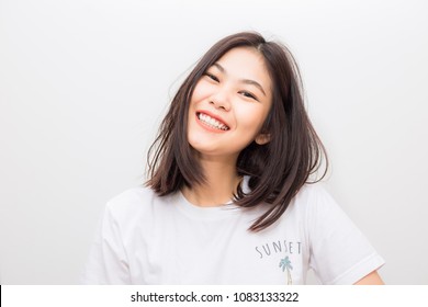 Attractive Cheerful asian young smiling to camera on white background