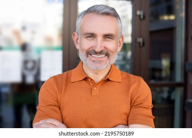 Attractive Confident Man With A Radiant Smile Looking Ahead