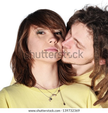 Similar – Young couple kissing in a studio portrait