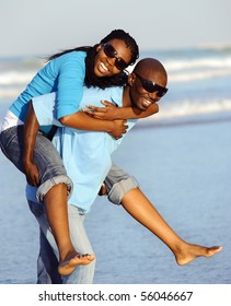 Attractive Couple Having Fun Together At The Beach