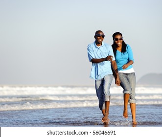 Attractive couple having fun together at the beach