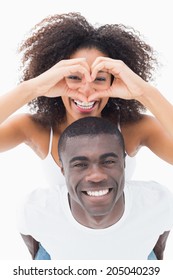 Attractive Couple In Matching Clothes Smiling At Camera On White Background