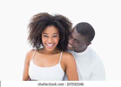 Attractive Couple In Matching Clothes Smiling At Camera On White Background