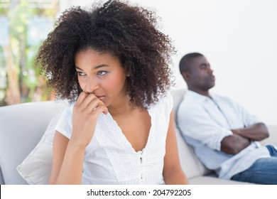 Attractive couple not talking on the couch at home in the living room