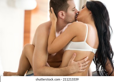 attractive couple in passion embrace kissing