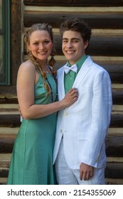 An Attractive Couple Posing For Pictures Before Their Senior Prom In Glenwood Springs, Colorado.