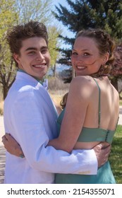 An Attractive Couple Posing For Pictures Before Their Senior Prom In Glenwood Springs, Colorado.