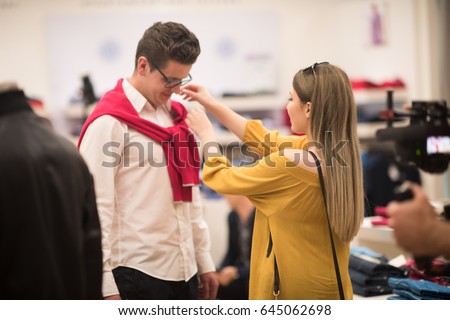 Attractive Couple Shopping In A Man's Clothing Store