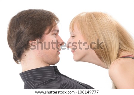 Similar – Man and woman face each other