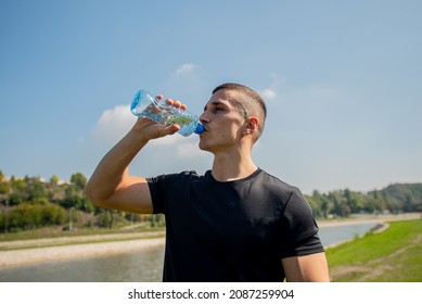 Attractive Dan Handsome Guy Is Drinking Water While Taking A Break From Training