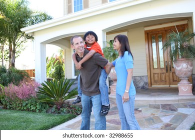 Attractive Diverse Family Outside Their Home Having Fun