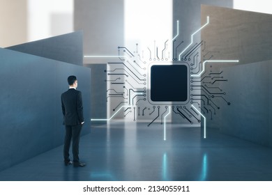 Attractive European Businessman Standing In Concrete Interior With Abstract Micro Chip And Mock Up Place. AI And Technology Concept