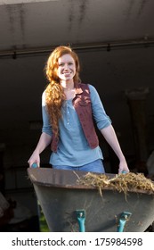 Attractive Farm Woman With A Wheel Barrow