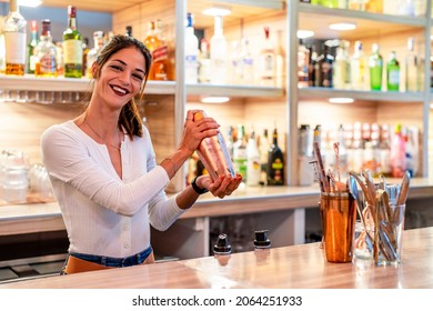 Attractive Female Bartender Preparing A Cocktail In A Pub