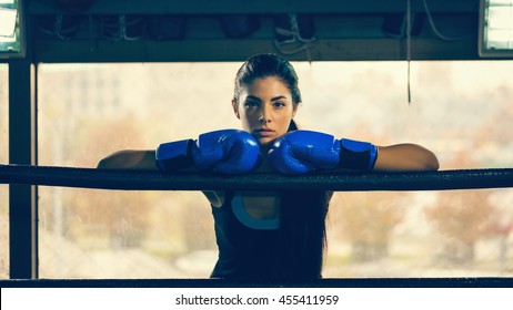 Attractive Female In Boxing Ring Leaning On Rope